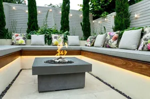 Festoon lighting in garden with fire pit